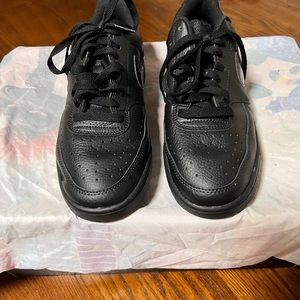 Black Nike athletic shoes